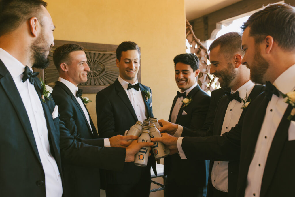 Playful Cheers to the groom Max and groomsmen wedding photography in Phoenix