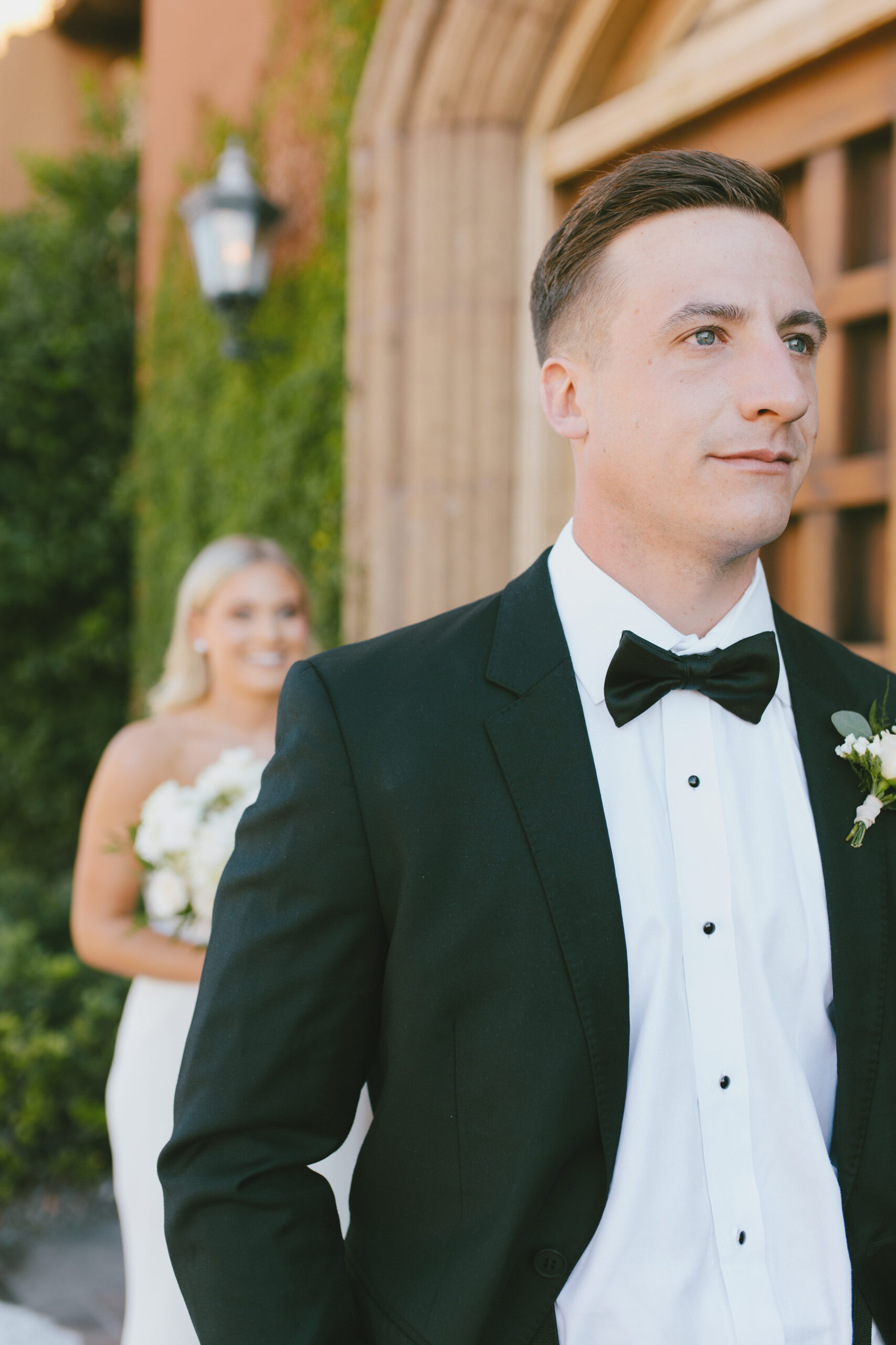 Matt and AlexaBefore the bride and groom first look focus on groom Timeless wedding photography in Phoenix