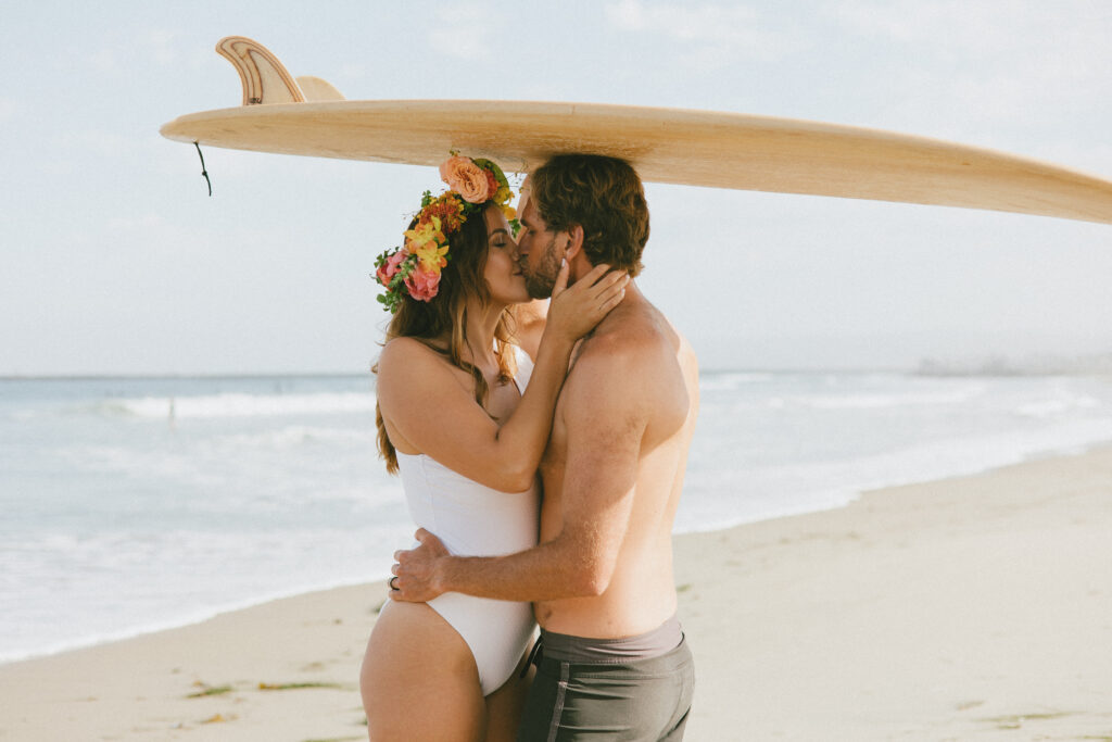 Including a prop in your Engagement session. Surf board and flower crown 