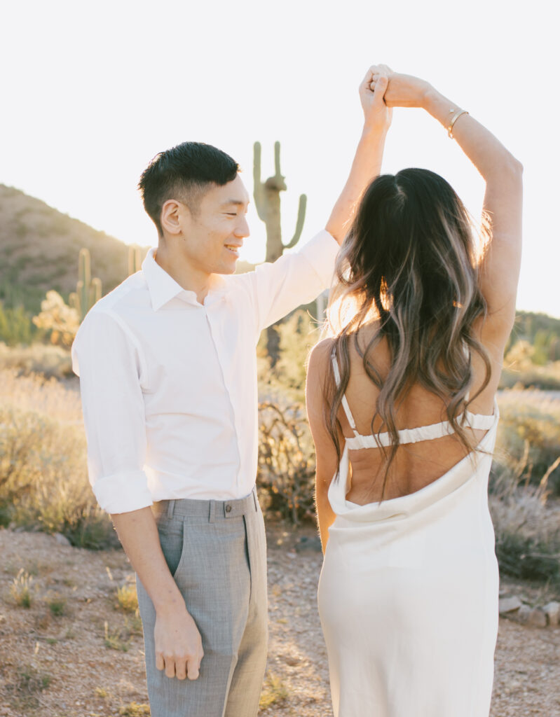 J and Alice's Arizona Engagement Session. J is twirling A during sunrise