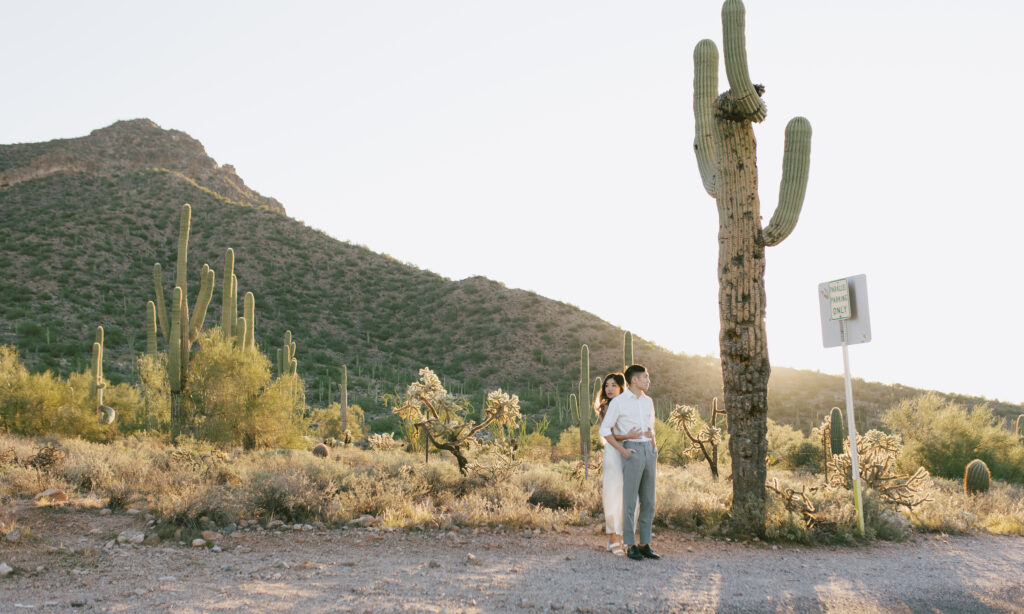 J and Alice’s Arizona Sunrise Engagement Session with a desert backdrop