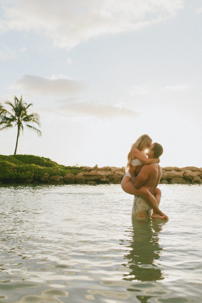 Sunset Oahu Engagement Session Gabby and Kyle Intimate embrace while in the water, Beach Engagement Session, Hawaii Engagement Photographer, Destination Engagement Photographer