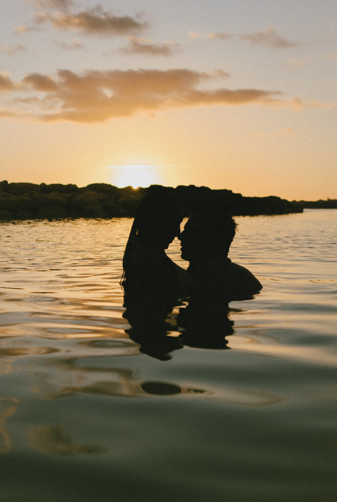 After sunset close up swimming in the ocean Oahu Engagement Session Gabby and Kyle, Beach Engagement Session, Hawaii Engagement Photographer, Destination Engagement Photographer
