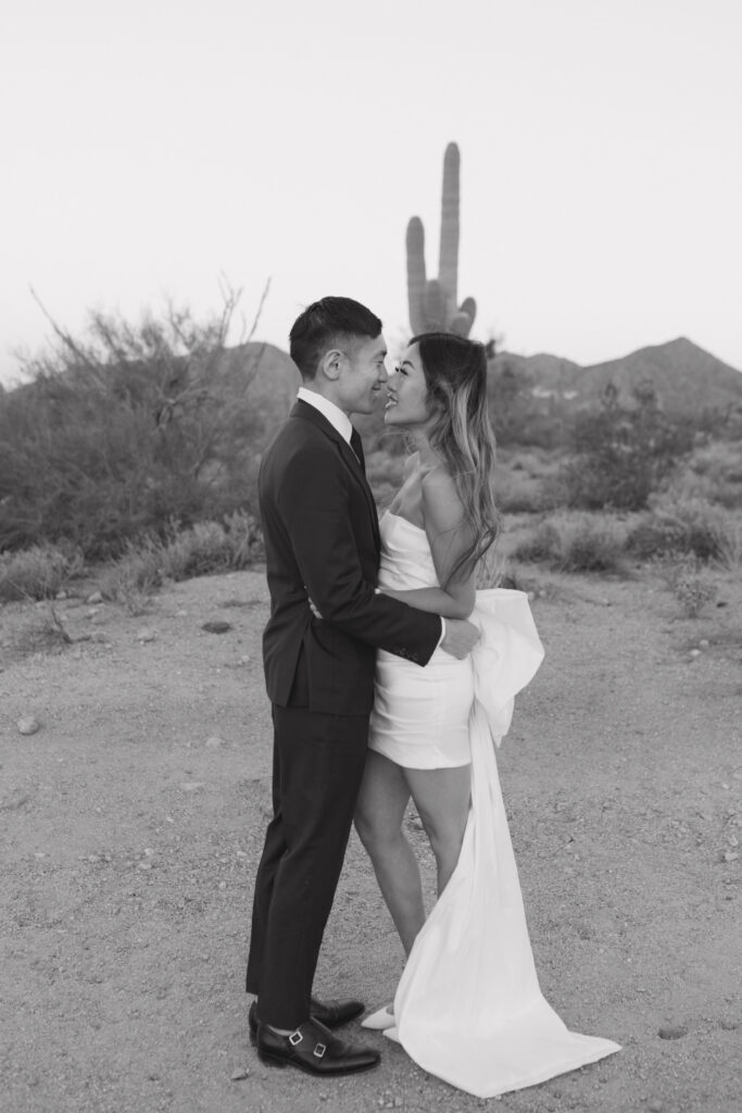 J and Alice's Arizona Sunrise Engagement Session sharing authentic laughter and an embrace formal attire black and white