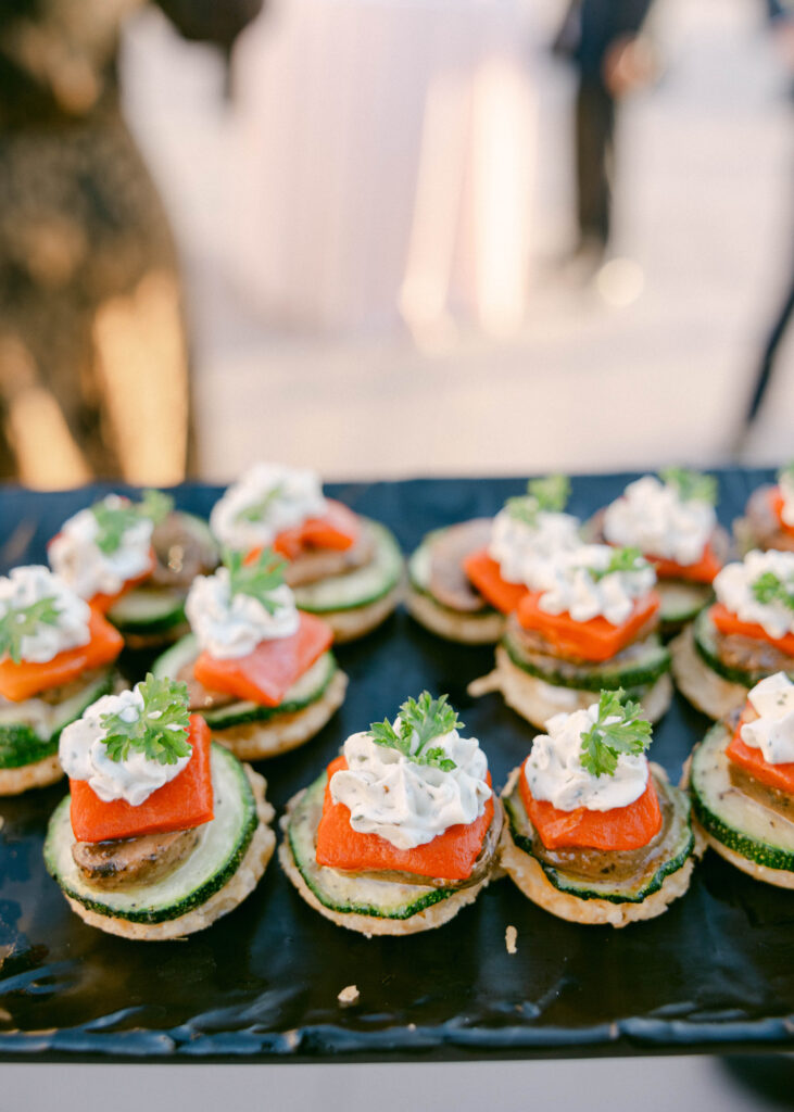 Steak and whipped feta appetizer on a plate during cocktail hour. 