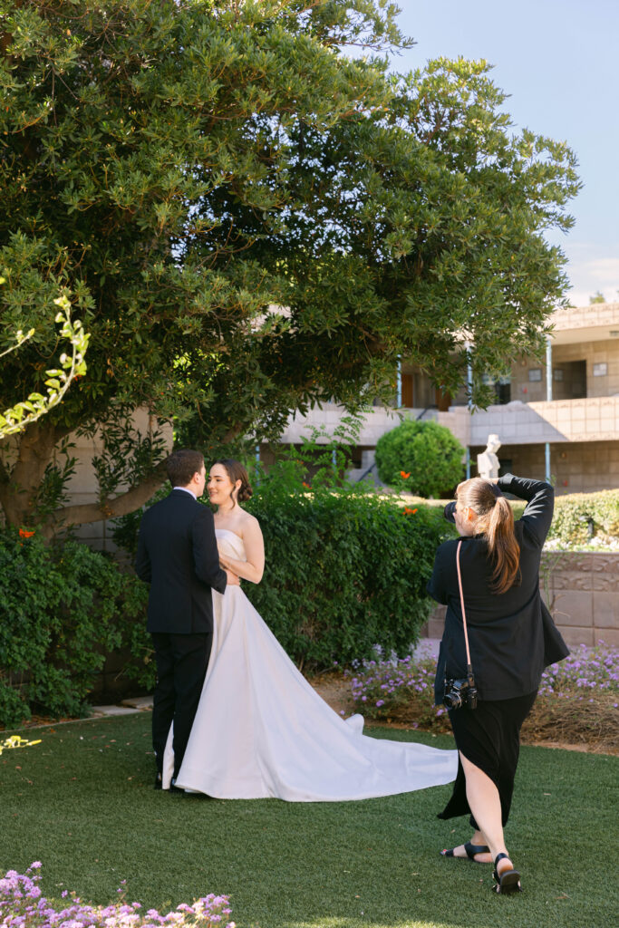 Luxury wedding photographer capturing intimate moments of the bride and groom during their elegant wedding celebration.