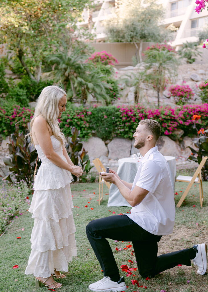 A romantic engagement proposal at The Phoenician in Scottsdale, featuring lush gardens and a breathtaking Camelback Mountain backdrop.