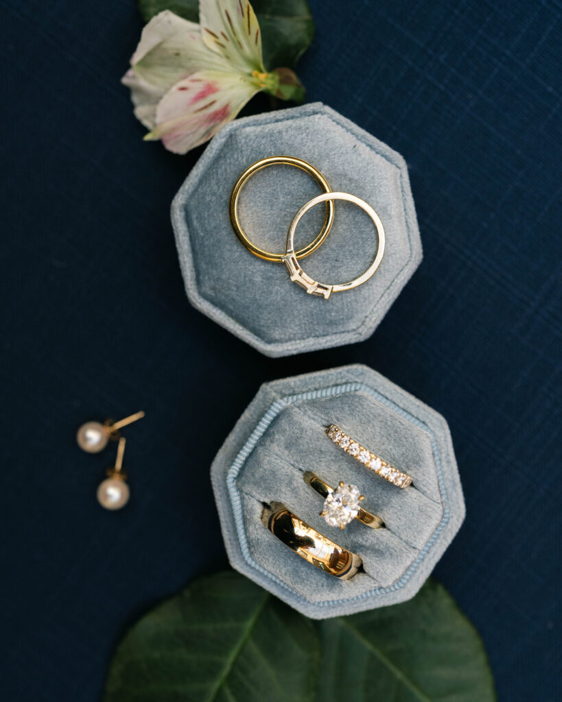 Close-up of engagement and wedding rings illustrating what to pack for your wedding detail photos.